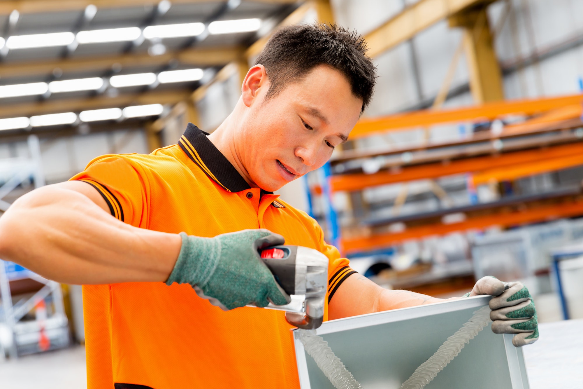 Asian worker in production plant on the factory floor